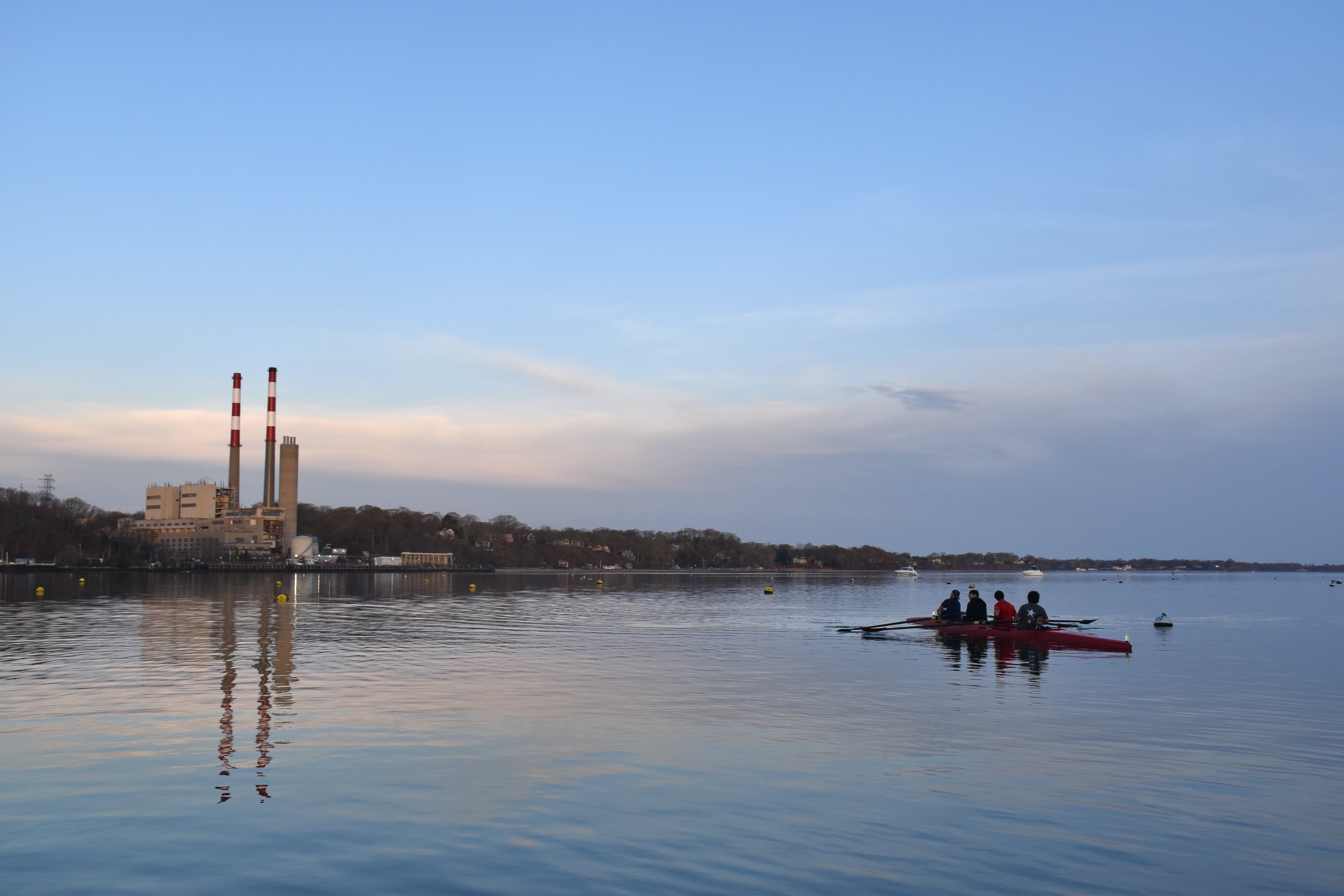 Boat rowing in Port Jefferson Harbor.